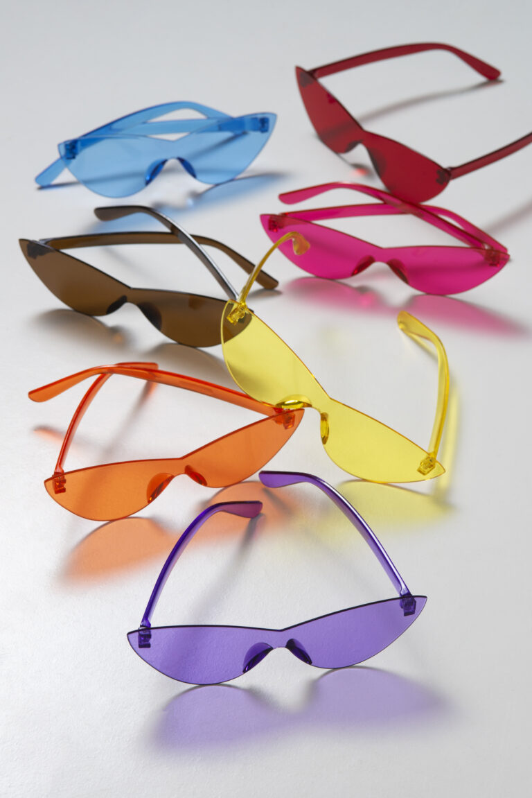 colored transparent sunglasses still life